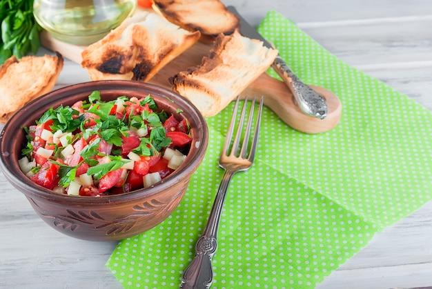 Salad of tomatoes and cheese and croutons for lunch