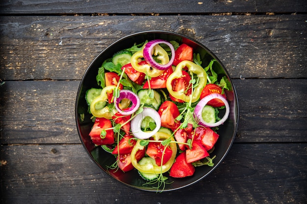 salad vegetables tomato cucumber pepper onion olive oil healthy food fresh portion veggie