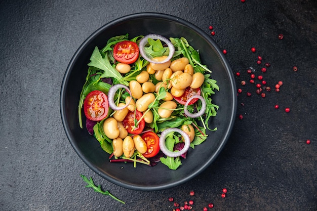 salad white bean tomato leaves mix lettuce fresh healthy meal diet snack on the table copy space