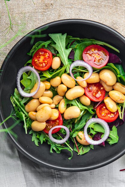 Salad white beans tomato leaves lettuce mix petals fresh portion healthy meal food diet snack