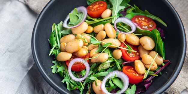 Salad white beans tomato leaves lettuce mix petals fresh portion healthy meal food diet snack