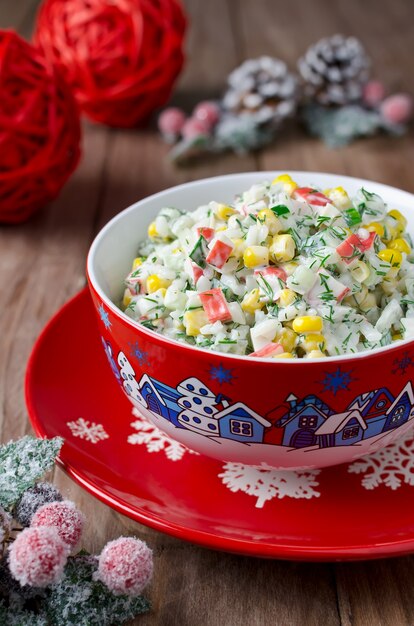 Salad with crab sticks, corn, cucumber, and rice