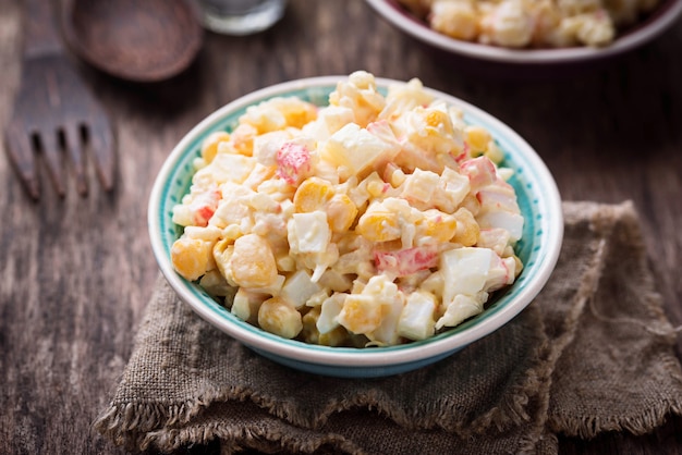 Salad with crab sticks, rice and corn