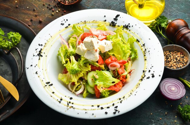 Salad with feta cheese and vegetables Top view Rustic style