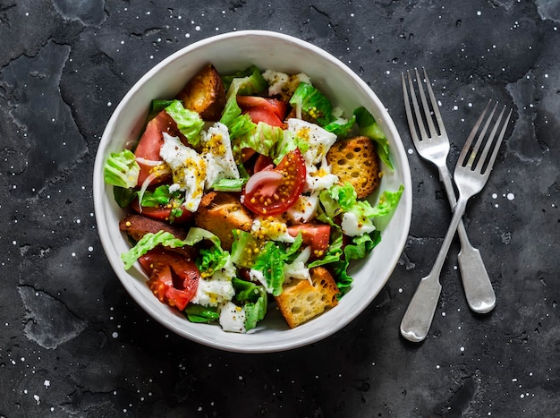 Salad with fresh tomatoes crunchy ciabatta bread mozzarella cheese green salad with olive oil