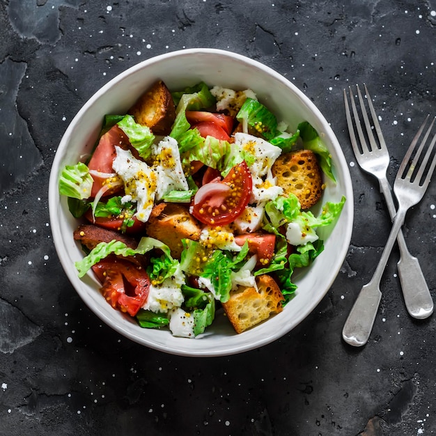 Salad with fresh tomatoes crunchy ciabatta bread mozzarella cheese green salad