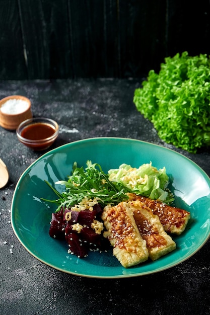 Salad with fried tofu and beets in a bowl Superfood