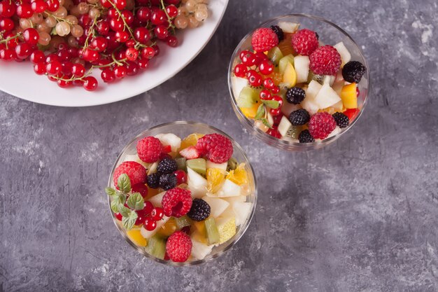 Salad with fruits and berries on a bowls 