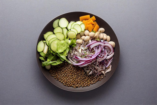 Salad with lentils and vegetables in a plate on the table vegetarian food healthy and vegan food