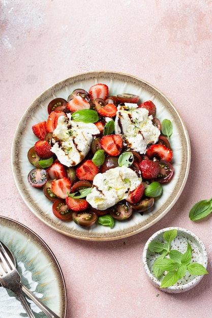 Salad with mozzarella strawberries and cherry tomatoes