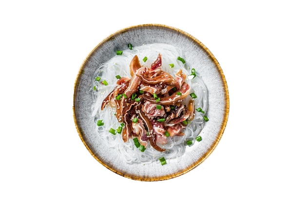 Salad with pork pig ears glass noodles sesame seeds and green onions Fried pork ears in korean style Isolated on white background