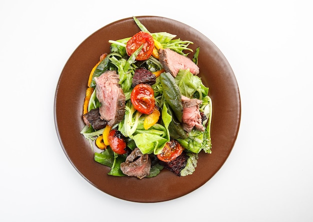 Salad with roastbeef and vegetables isolated on white