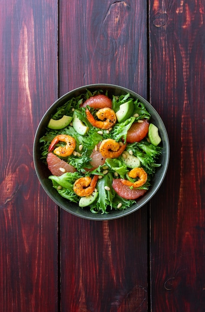 Salad with shrimp grapefruit avocado and nuts Healthy eating Diet