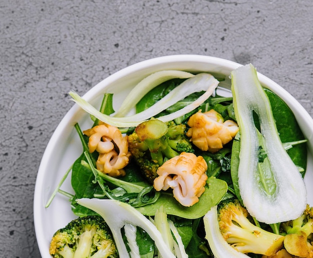 Salad with squid fennel and baked broccoli