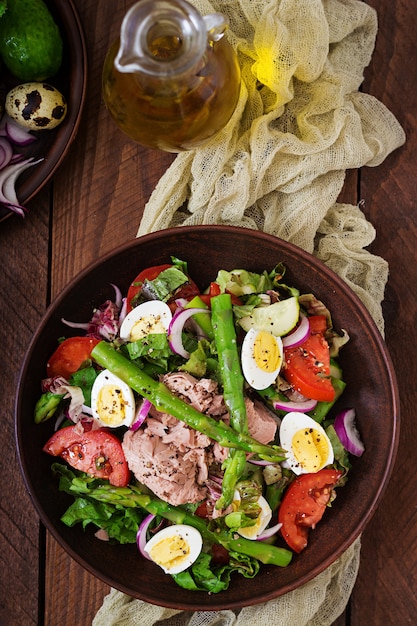 Salad with tuna, tomatoes, asparagus and onion. Salad Nicoise