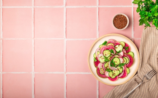 Salad with watermelon radish, cucumber and red onion