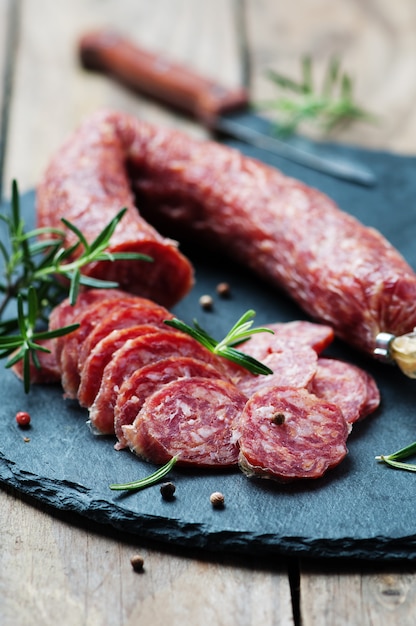 Salami on the wooden table