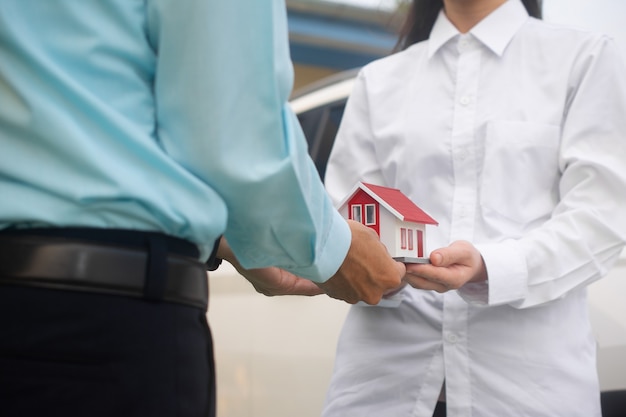 Salesman giving house to customer