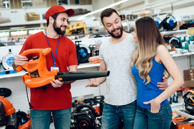 Salesman is Showing New Leaf Blower to Clients