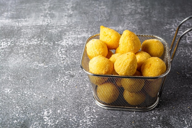 'salgadinho de festa' or brazilian traditional party snack a mix with coxinha and bolinha de queijo