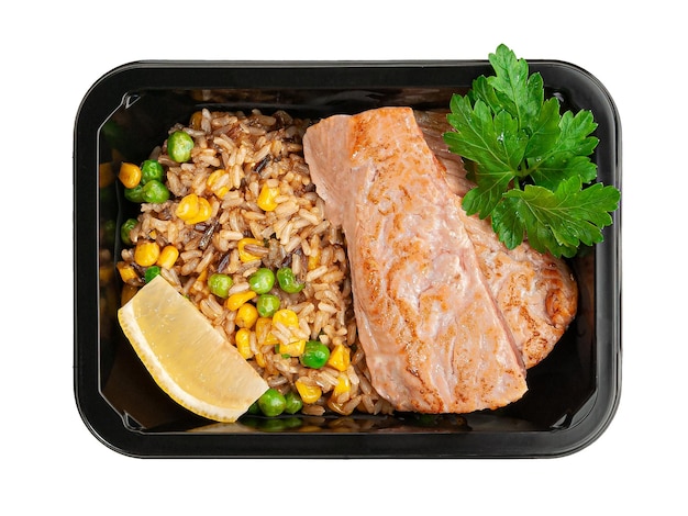 Salmon fillet with brown rice and vegetables In a food delivery container White background View from above Isolated