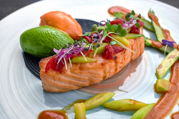 Salmon fillet with confit tomatoes and green asparagus