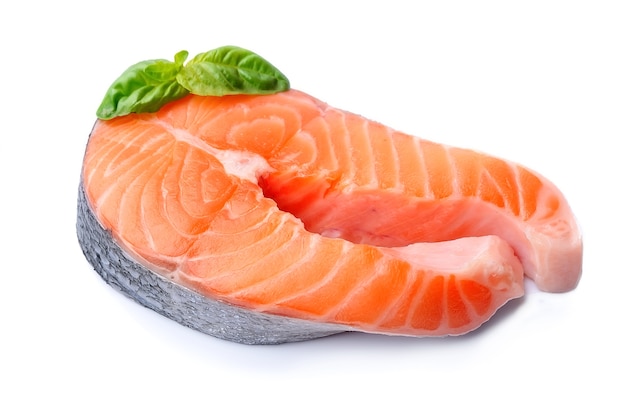 Salmon fish with basil leaves isolated on white backgrounds.