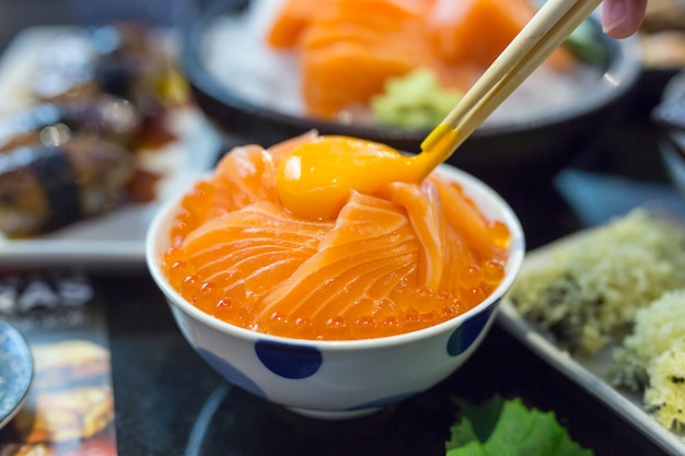 Salmon ikura donburi with salmon roe and egg yolk