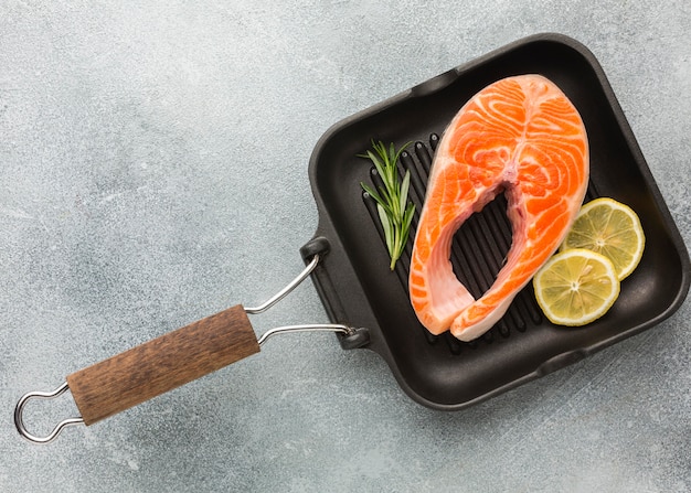 Salmon and lemon on pan flat lay