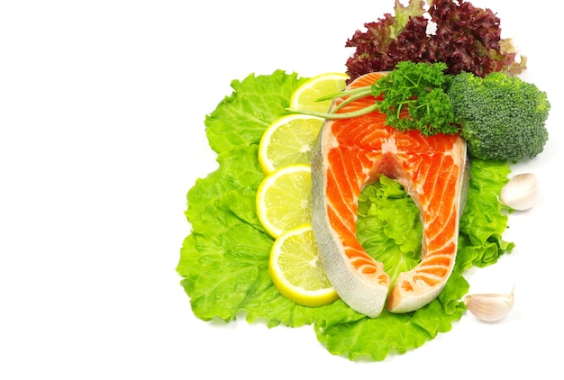 Salmon and lettuce isolated on white background