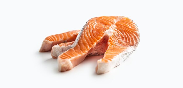 Salmon raw steaks isolated on white background.