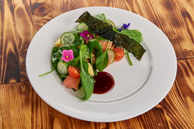 Salmon Salad with spinach, cherry tomatoes, corn salad, baby spinach, fresh mint and basil