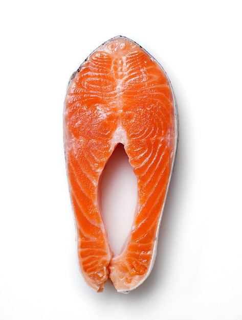 Salmon sliced into pieces on white