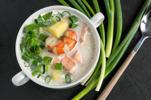 Salmon soup with, potatoes, carrots, and dill