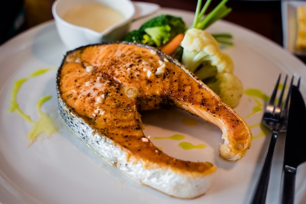 Salmon steak on the white plate