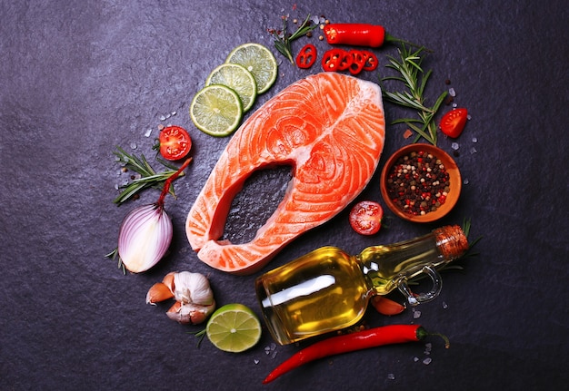 Salmon steak with lemon tomatoes and spices with olive oil