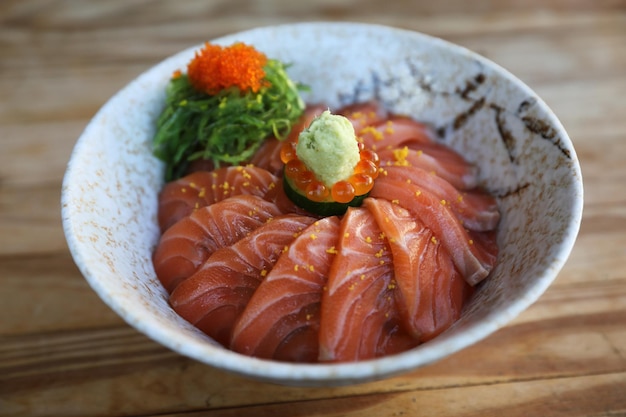 Salmon sushi don on wood background , Japanese food