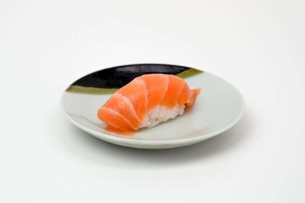 Salmon sushi nigiri japanese cuisine on plate