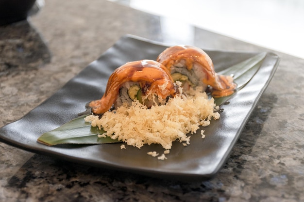 Salmon Sushi with Sauce on Plate