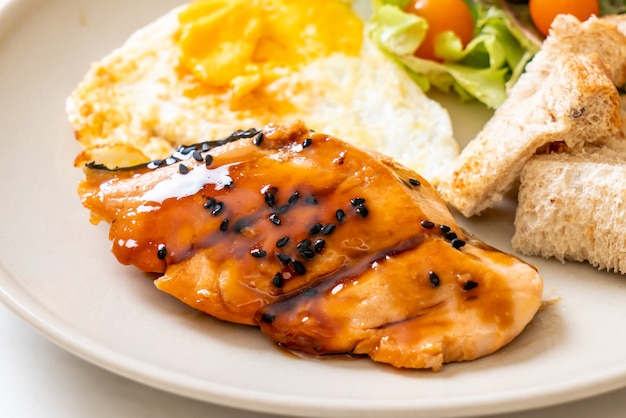 salmon teriyaki steak with fried egg and salad