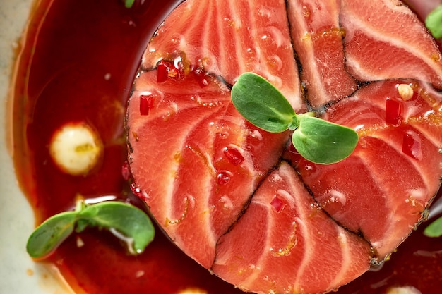 Salmon terrine with sauces in a plate. Close-up, selective focus