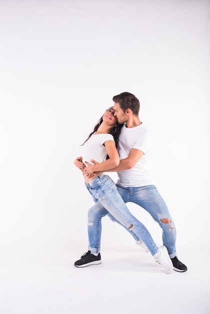 Salsa, kizomba and bachata dancers on white background. Social dance concept.