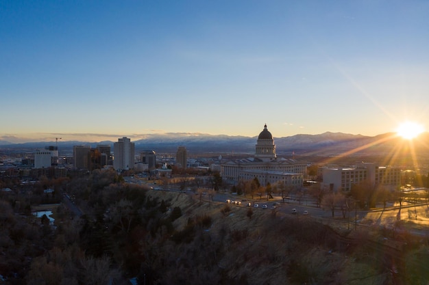 SALT LAKE CITY, USA - JANUARY 30, 2021: Utah State Capitol Building at Sunset in Winter. Capitol Hill. Utah, USA. Aerial View. Golden Hour.