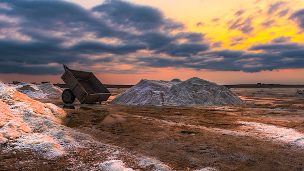 Salt mining on the lake during sunset