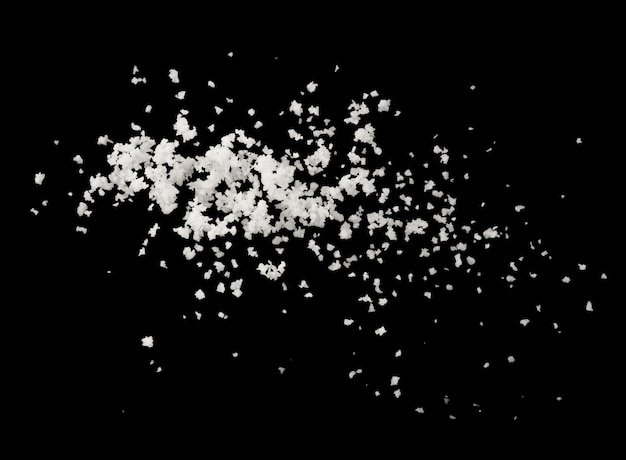 Photo salt splash explosion  isolated on black background , freeze stop motion