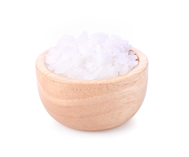 Salt in wood bowl on white background