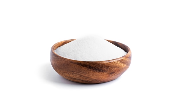 Salt in a wooden bowl isolated on a white background. High quality photo