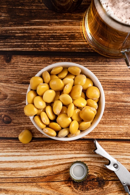 Salted Lupin Beans with beer on table