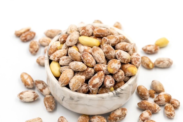 Salted peanuts kernel on a white background Closeup local name tuzlu yer fistigi