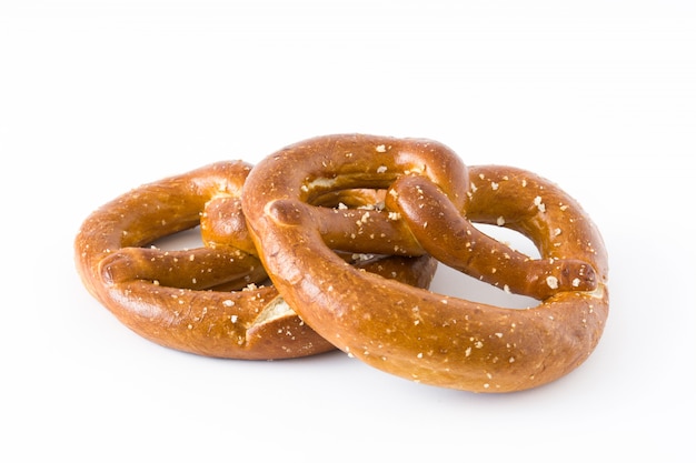 Salted pretzels isolated on white surface